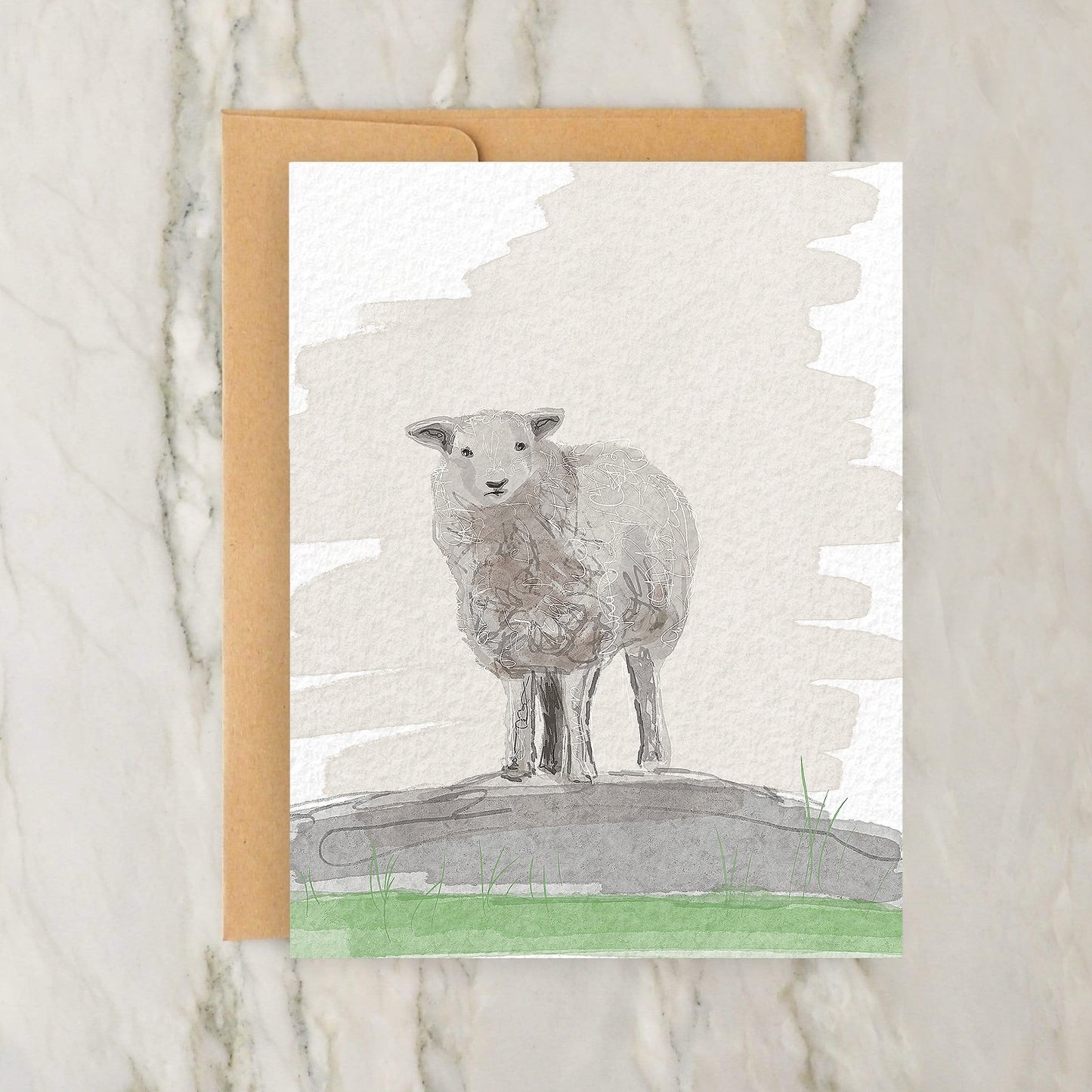 a card of a sheep standing on a rock