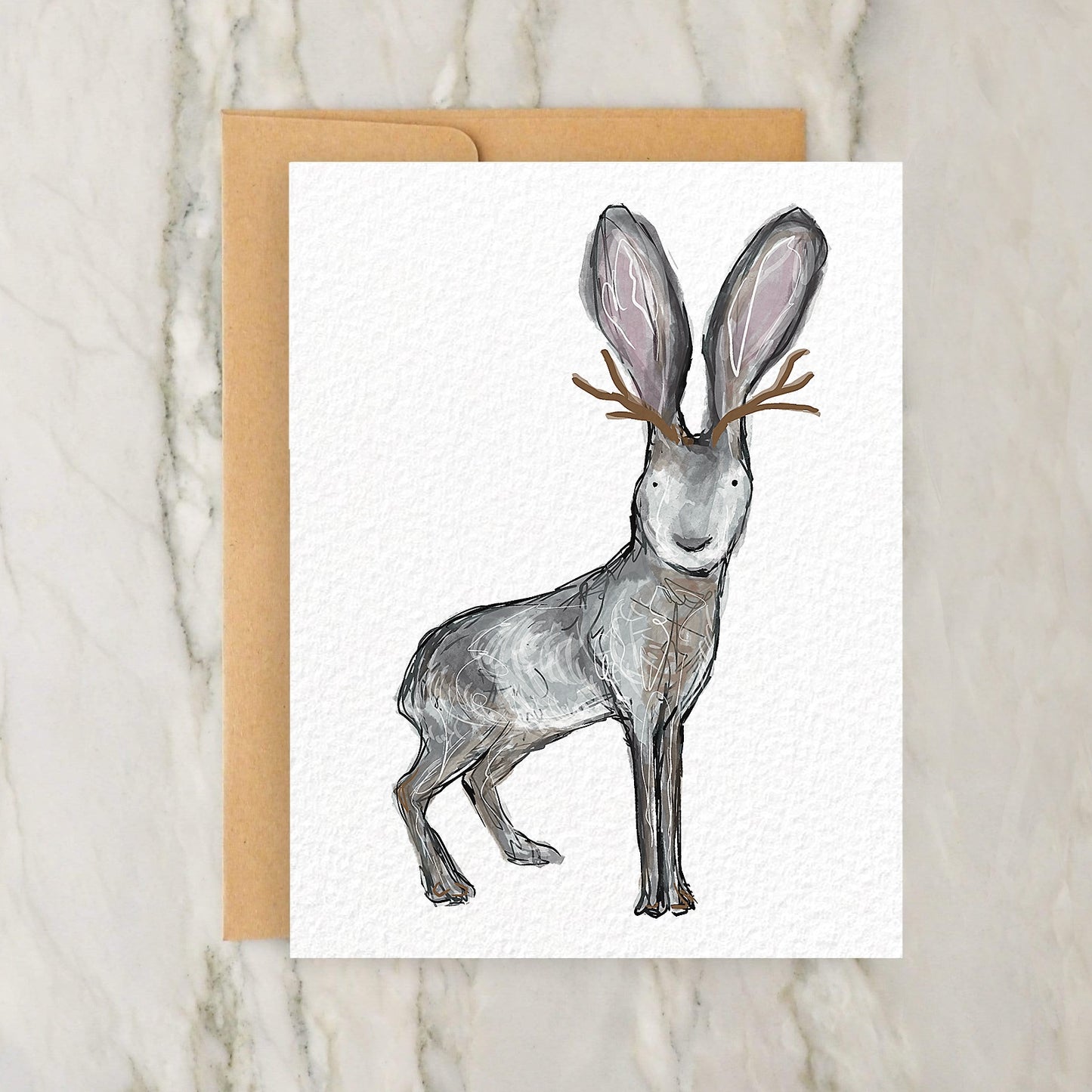 a card with a drawing of a rabbit wearing antlers