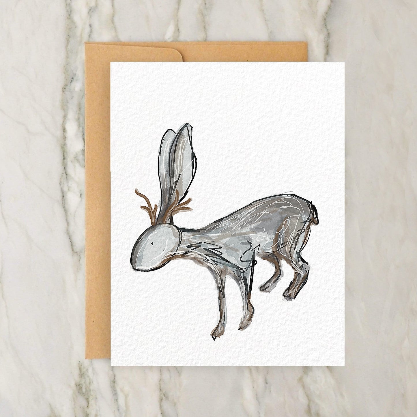 a card with a drawing of a deer on it