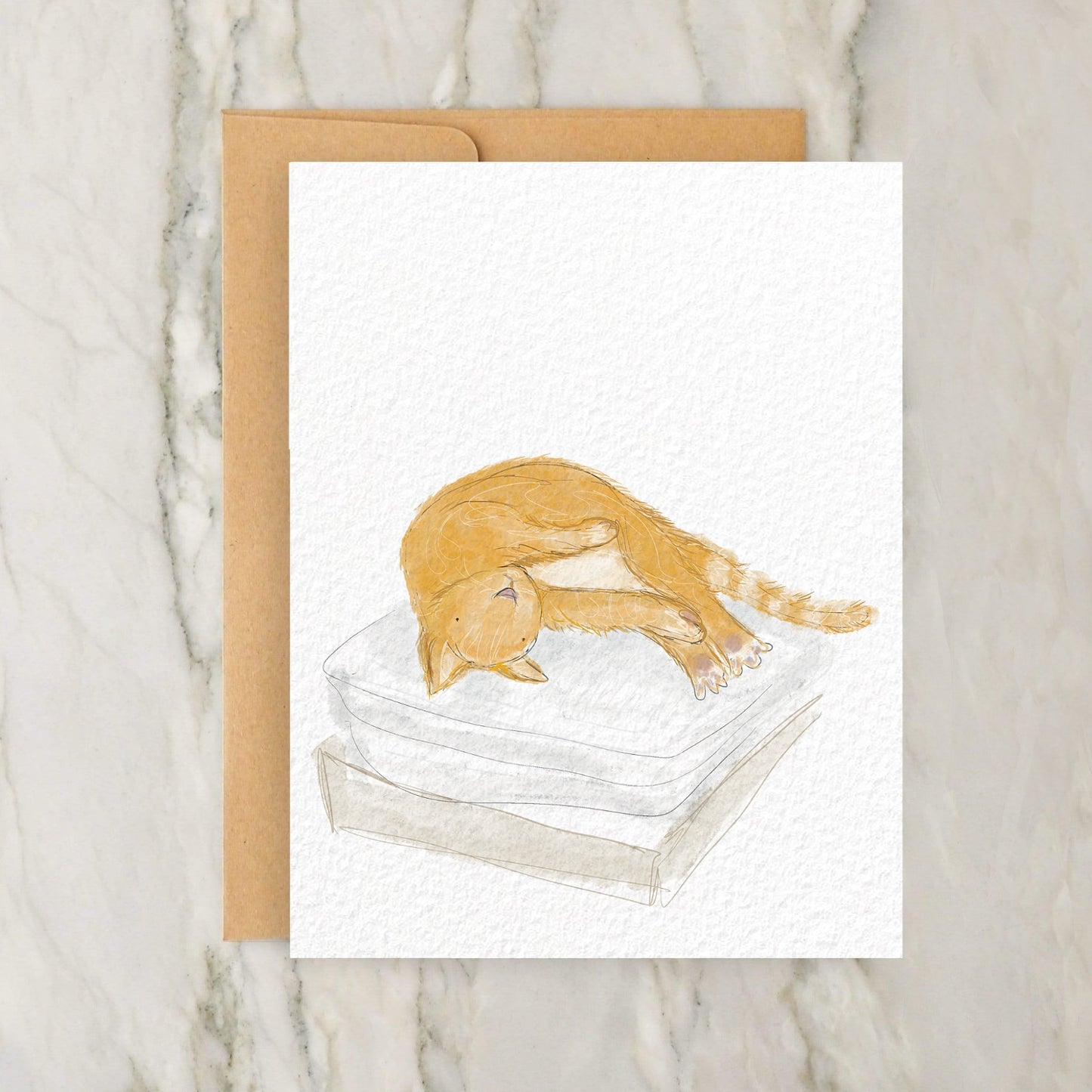 a card with an orange cat sleeping on a mattress