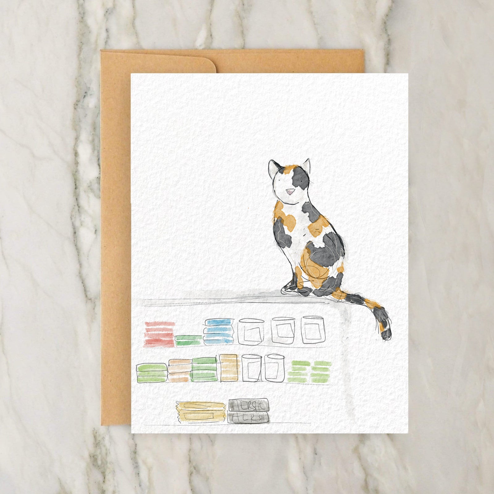 a card with a cat sitting on top of a table