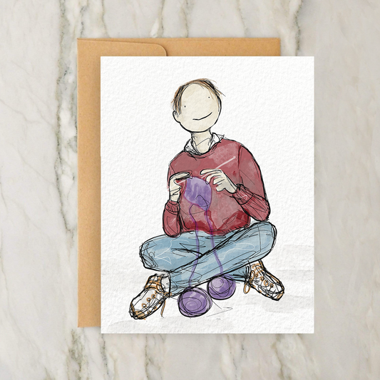 a card with a drawing of a person sitting on the ground